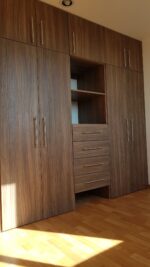 Interior Designers. Simple Built-in Wardrobe Designs For Bedrooms Create a neat and organized bedroom with simple built-in wardrobe designs that maximize storage and complement your interior. Built-in wardrobes provide a practical way to store clothes, shoes, accessories, and personal items. These wardrobes can fit directly into your bedroom layout. Moreover, they make excellent use of available wall space. With the right design, you can create a clean appearance without making the room feel crowded. Modern Built-in Wardrobe Designs Simple wardrobes focus on clean lines and practical storage. Minimalist doors can create a smooth and uncluttered appearance. Choose neutral colors for a calm bedroom atmosphere. White, beige, grey, and wood finishes remain versatile choices. Furthermore, subtle handles or handleless doors can enhance the modern appearance. Floor-to-Ceiling Bedroom Wardrobes Floor-to-ceiling wardrobes maximize vertical storage space. They provide additional room for clothes, bedding, luggage, and accessories. The upper sections can store items that are not used frequently. Meanwhile, lower sections can hold everyday clothing. As a result, your bedroom can remain more organized. Built-in Wardrobes With Smart Storage Good wardrobe design should make storage easy to access. Hanging rails provide space for shirts, dresses, jackets, and trousers. Shelves can hold folded clothes and bags. Drawers can store smaller accessories. In addition, dedicated shoe compartments can keep footwear organized. Small Bedroom Built-in Wardrobes Built-in wardrobes are especially useful in smaller bedrooms. They can use wall space efficiently without taking up unnecessary floor area. Sliding doors can save additional space. Mirrors can also create a brighter and more spacious appearance. Therefore, compact bedrooms can benefit from carefully planned wardrobe layouts. Built-in Wardrobes With Sliding Doors Sliding wardrobes provide a modern and practical solution. Their doors move horizontally instead of opening into the room. This design works well where floor space is limited. Moreover, sliding doors can feature mirrors, glass panels, wood finishes, or minimalist laminates. Key Features Simple built-in wardrobe designs Floor-to-ceiling storage options Sliding and hinged doors Adjustable shelves Hanging rails Built-in drawers Dedicated shoe storage Accessory compartments Mirror door options Modern wood and laminate finishes Handleless wardrobe options Custom sizes and layouts Custom Bedroom Wardrobe Designs Every bedroom has different dimensions and storage requirements. Therefore, custom wardrobes can provide a more precise fit. You can choose the wardrobe height, width, depth, door style, colors, and internal arrangement. Furthermore, custom layouts can make use of corners and unusual wall spaces. Stylish Wardrobe Finishes The wardrobe finish can influence the entire bedroom appearance. Wood-inspired finishes add warmth and natural character. Glossy finishes can reflect light and create a modern look. Meanwhile, matte finishes provide a softer and more understated appearance. You can also combine two finishes for additional visual interest. However, the colors should complement the existing bedroom décor. Easy Wardrobe Organization A well-planned wardrobe makes daily routines easier. Keep frequently used clothing within easy reach. Store seasonal items in higher compartments. Use drawers for smaller accessories. Furthermore, organized shelves can prevent clothing from becoming cluttered. Durable and Easy-to-Maintain Wardrobes Quality wardrobe materials can support regular daily use. Strong hinges, smooth drawer runners, and durable handles can improve long-term performance. Clean wardrobe surfaces with suitable products. Avoid excessive moisture on materials that are not moisture-resistant. Proper care helps maintain the wardrobe's appearance. Why Choose Simple Built-in Wardrobes? Simple built-in wardrobes combine practical storage with clean bedroom aesthetics. They can help reduce clutter while making better use of available space. Moreover, their customizable layouts allow you to organize belongings according to your lifestyle. You can create storage for clothing, shoes, accessories, bedding, and more. Upgrade Your Bedroom Storage Transform your bedroom with simple built-in wardrobe designs tailored to your space. Choose from sliding doors, hinged doors, mirrored panels, wood finishes, and minimalist styles. With smart internal storage and a carefully planned layout, your wardrobe can improve both organization and bedroom appearance. Ultimately, a simple built-in wardrobe provides a practical, stylish, and space-efficient storage solution.