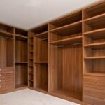 Interior Designers. Simple Built-in Wardrobe Designs For Bedrooms Create a neat and organized bedroom with simple built-in wardrobe designs that maximize storage and complement your interior. Built-in wardrobes provide a practical way to store clothes, shoes, accessories, and personal items. These wardrobes can fit directly into your bedroom layout. Moreover, they make excellent use of available wall space. With the right design, you can create a clean appearance without making the room feel crowded. Modern Built-in Wardrobe Designs Simple wardrobes focus on clean lines and practical storage. Minimalist doors can create a smooth and uncluttered appearance. Choose neutral colors for a calm bedroom atmosphere. White, beige, grey, and wood finishes remain versatile choices. Furthermore, subtle handles or handleless doors can enhance the modern appearance. Floor-to-Ceiling Bedroom Wardrobes Floor-to-ceiling wardrobes maximize vertical storage space. They provide additional room for clothes, bedding, luggage, and accessories. The upper sections can store items that are not used frequently. Meanwhile, lower sections can hold everyday clothing. As a result, your bedroom can remain more organized. Built-in Wardrobes With Smart Storage Good wardrobe design should make storage easy to access. Hanging rails provide space for shirts, dresses, jackets, and trousers. Shelves can hold folded clothes and bags. Drawers can store smaller accessories. In addition, dedicated shoe compartments can keep footwear organized. Small Bedroom Built-in Wardrobes Built-in wardrobes are especially useful in smaller bedrooms. They can use wall space efficiently without taking up unnecessary floor area. Sliding doors can save additional space. Mirrors can also create a brighter and more spacious appearance. Therefore, compact bedrooms can benefit from carefully planned wardrobe layouts. Built-in Wardrobes With Sliding Doors Sliding wardrobes provide a modern and practical solution. Their doors move horizontally instead of opening into the room. This design works well where floor space is limited. Moreover, sliding doors can feature mirrors, glass panels, wood finishes, or minimalist laminates. Key Features Simple built-in wardrobe designs Floor-to-ceiling storage options Sliding and hinged doors Adjustable shelves Hanging rails Built-in drawers Dedicated shoe storage Accessory compartments Mirror door options Modern wood and laminate finishes Handleless wardrobe options Custom sizes and layouts Custom Bedroom Wardrobe Designs Every bedroom has different dimensions and storage requirements. Therefore, custom wardrobes can provide a more precise fit. You can choose the wardrobe height, width, depth, door style, colors, and internal arrangement. Furthermore, custom layouts can make use of corners and unusual wall spaces. Stylish Wardrobe Finishes The wardrobe finish can influence the entire bedroom appearance. Wood-inspired finishes add warmth and natural character. Glossy finishes can reflect light and create a modern look. Meanwhile, matte finishes provide a softer and more understated appearance. You can also combine two finishes for additional visual interest. However, the colors should complement the existing bedroom décor. Easy Wardrobe Organization A well-planned wardrobe makes daily routines easier. Keep frequently used clothing within easy reach. Store seasonal items in higher compartments. Use drawers for smaller accessories. Furthermore, organized shelves can prevent clothing from becoming cluttered. Durable and Easy-to-Maintain Wardrobes Quality wardrobe materials can support regular daily use. Strong hinges, smooth drawer runners, and durable handles can improve long-term performance. Clean wardrobe surfaces with suitable products. Avoid excessive moisture on materials that are not moisture-resistant. Proper care helps maintain the wardrobe's appearance. Why Choose Simple Built-in Wardrobes? Simple built-in wardrobes combine practical storage with clean bedroom aesthetics. They can help reduce clutter while making better use of available space. Moreover, their customizable layouts allow you to organize belongings according to your lifestyle. You can create storage for clothing, shoes, accessories, bedding, and more. Upgrade Your Bedroom Storage Transform your bedroom with simple built-in wardrobe designs tailored to your space. Choose from sliding doors, hinged doors, mirrored panels, wood finishes, and minimalist styles. With smart internal storage and a carefully planned layout, your wardrobe can improve both organization and bedroom appearance. Ultimately, a simple built-in wardrobe provides a practical, stylish, and space-efficient storage solution.